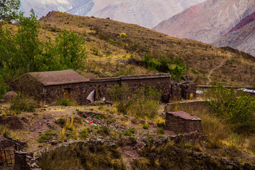 View of Iruya village and multicolored mountains in the surroundings at sunset, Salta province, Argentina, iruya - San Isidro - San Juan treeking
