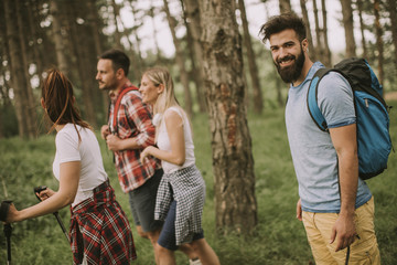 Group of young people are hiking in mountain