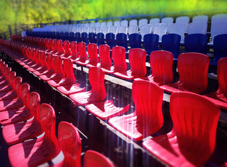 Fototapeta premium Broken red and blue stadium seats background