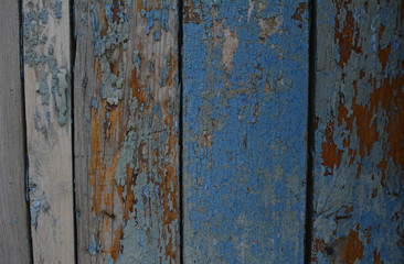 surface texture with flaky old paint on wooden boards
