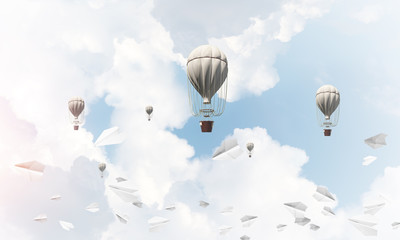 Flying hot air balloons in the air.