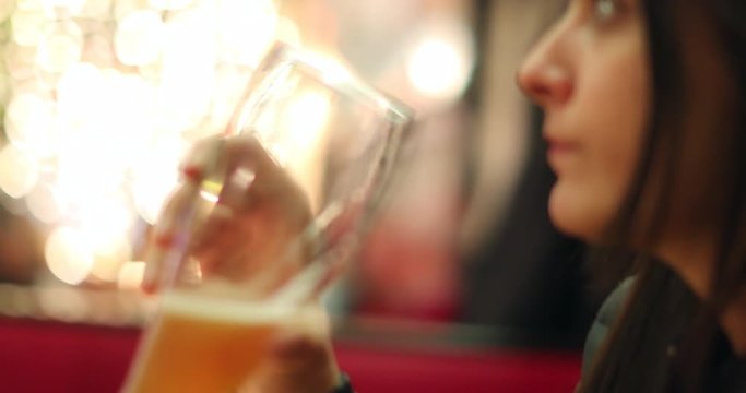 Woman drinking draft traditional beer in Munich germany