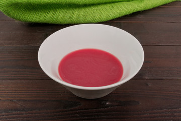 Beet soup with wine on a table