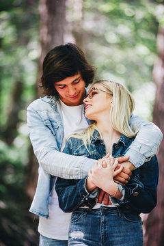 Beautiful young couple inlove standing in nature ambyent