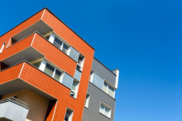 Exterior of a modern  apartment buildings on a blue sky background. No people.