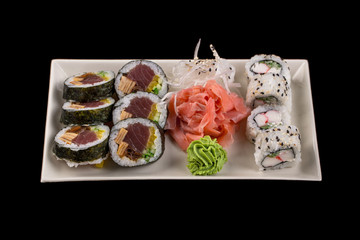 Sushi set isolated on the black background.