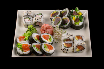 Sushi set isolated on the black background.