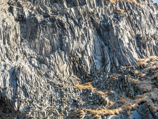 Fototapeta premium Basalt rock mountain near black sand beach in Iceland