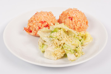 Tomato rice and salad on a white