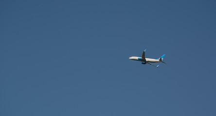 Airplane in the blue sky and cloud