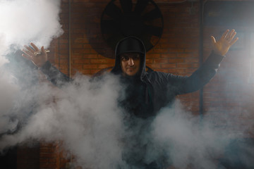 Man in a cloud of white vapour fume