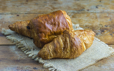 French croissants on rustic background