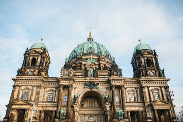 Fototapeta na wymiar The Berlin Cathedral is called Berliner Dom. Beautiful old building in the style of neoclassicism and baroque with cross and sculptures.