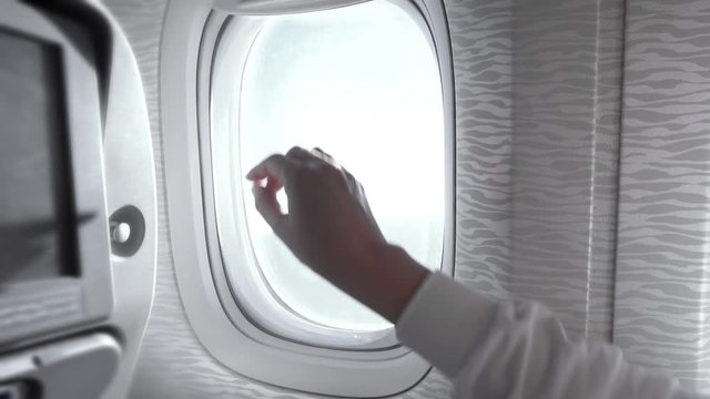 Close airplane window inside plane interior