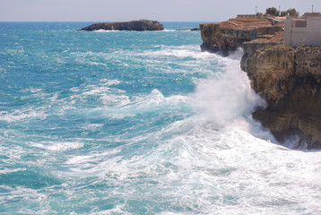 View of cliff of Polignano a Mare with rough sea