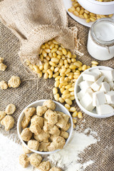 Ecological texturized soy meat with soy beans and tofu on rustic background