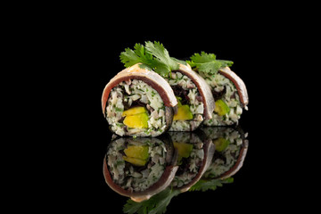 sushi rolls isolated on the black background