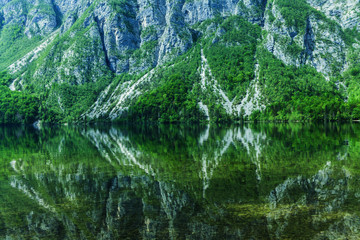 The mountains are reflected in the lake. Alpine landscape