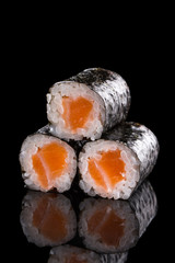 sushi rolls isolated on the black background