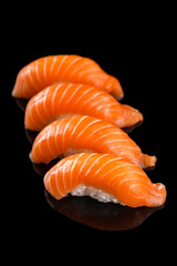 salmon nigiri sushi on the black background