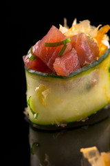gunkan maki with tuna - sushi on the black background