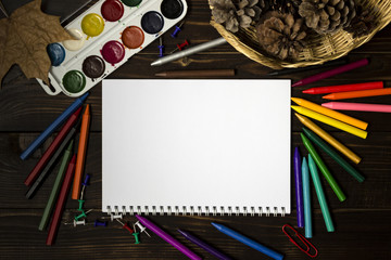 Back to school, autumn, the beginning of school. Background, set of clerical objects: notebook, pen, paints and other