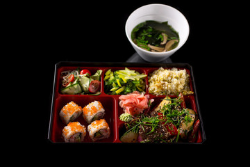 sushi lunch set isolated on the black background