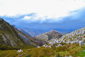 View of rocks in middle of a mountain in a cloudy day