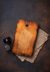 Empty vintage cutting board and spices