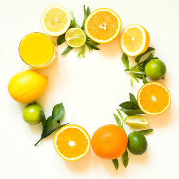 Summer set of tropical fruits, lemon, orange and green leaves on white. Banner.
