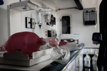 Bag Valve Mask sitting crookedly within the interior of an ambulance