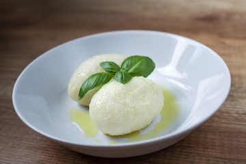 Homemade potato noodles with meat on the white plate