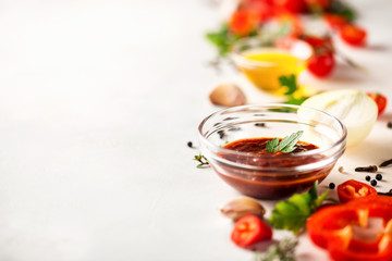 Homemade sauce adjika with pepper, garlic, tomatoes and parsley. Selective focus. Copy space