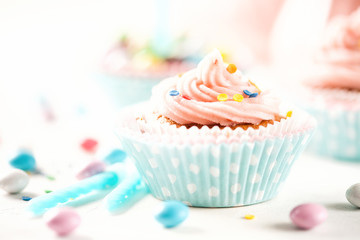 Strawberry cupcakes with color candies