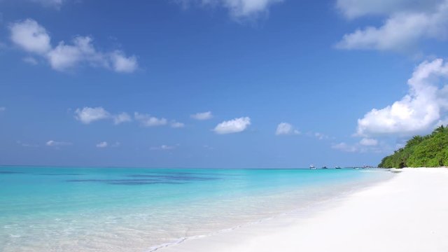 Perfect wild sandy Maldives coastline with turquoise sea view
