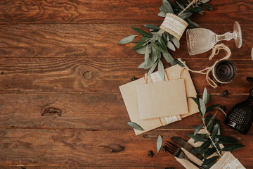 Empty wedding card on plate with rustic wedding decorations. Rural organic eco style. Top view, flat lay