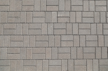 the wall and floor which is laid out by a regular concrete square tile with the geometrical drawing. Top view