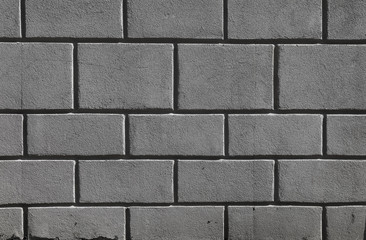 the wall and floor which is laid out by a regular concrete square tile with the geometrical drawing. Top view