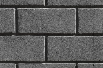 the wall and floor which is laid out by a regular concrete square tile with the geometrical drawing. Top view