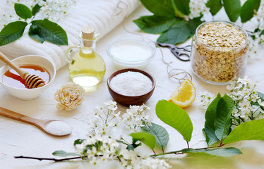 Obraz na płótnie Canvas Natural Ingredients for Homemade Oat Body Face Milk Scrub Salt Oil Honey Beauty Concept Organic Eco Healthy Lifestyle Flowers 
