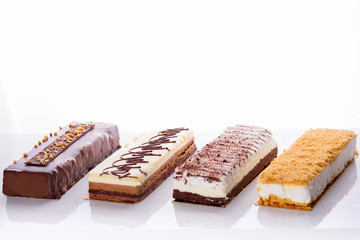 Beautiful Delicious dessert cheesecakes and chocolate cake. Group of four different types of sweet for holiday Shavuot.