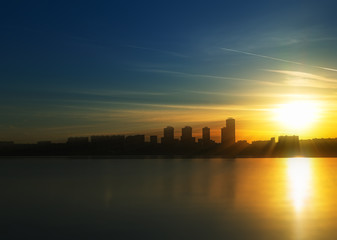 Dramatic light rays over skyscrapers architecture background