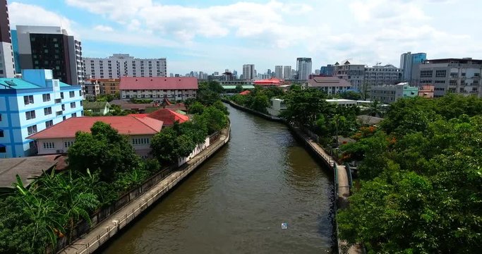 Bangkok City Ascending Drone Shot Over Canal and Skyscrapers