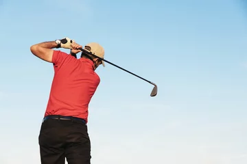 Fotobehang Golfist playing on golf course. © santypan