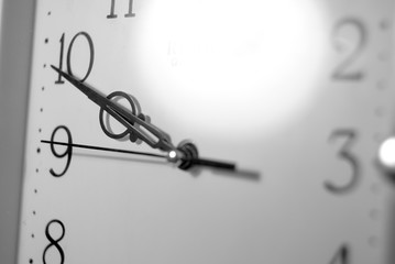 closeup photo of a black and white clock.