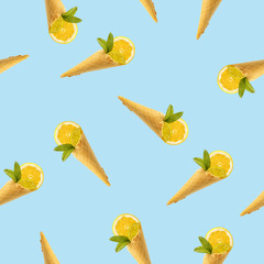 Seamless pattern with a picture of a horn for ice cream, lemon and mint