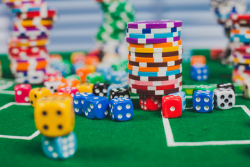 Poker chips on table in casino. Cards on green felt casino table