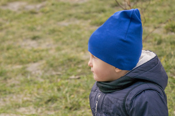 Cute pensive little boy on walking