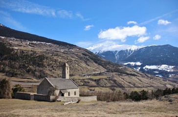 Fototapeta na wymiar San Vito alpine church in Malles (Tarces hill), Val Venosta, Alto Adige, Italy