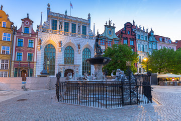 Fototapeta na wymiar Fountain of the Neptune in old town of Gdansk at dawn, Poland